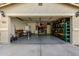 Two-car garage with storage shelving and work area at 1615 E Maddison Cir, San Tan Valley, AZ 85140