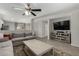 Open living room with gray sectional sofa and large flat screen TV at 1615 E Maddison Cir, San Tan Valley, AZ 85140