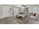 Spacious living room with gray sectional sofa and gray wood coffee table at 1615 E Maddison Cir, San Tan Valley, AZ 85140