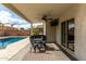 Covered patio with outdoor dining set and ceiling fan at 1615 E Maddison Cir, San Tan Valley, AZ 85140