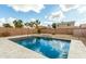 Inviting rectangular pool with tiled patio and water feature at 1615 E Maddison Cir, San Tan Valley, AZ 85140