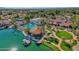 Stunning aerial view of the community clubhouse, pool, lake, and tennis courts on a sunny day at 1633 E Lakeside Dr # 127, Gilbert, AZ 85234