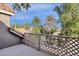 A balcony with a fence and palm trees in the distance at 1633 E Lakeside Dr # 127, Gilbert, AZ 85234