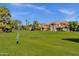 Beautifully maintained green space in the community with mature trees and well-kept buildings at 1633 E Lakeside Dr # 127, Gilbert, AZ 85234