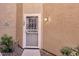 Close up of the front door with security screen, address number, and porch light at 1633 E Lakeside Dr # 127, Gilbert, AZ 85234