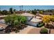 Two-story house with tile roof and landscaping in a neighborhood setting at 17149 E El Pueblo Blvd, Fountain Hills, AZ 85268