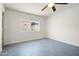 Bedroom with tile floors, a window, and a ceiling fan at 17149 E El Pueblo Blvd, Fountain Hills, AZ 85268