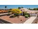 Two-story house with tile roof, desert landscaping, and gated entry at 17149 E El Pueblo Blvd, Fountain Hills, AZ 85268