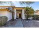 Front entry with wood door, sidelights, and walkway at 17149 E El Pueblo Blvd, Fountain Hills, AZ 85268