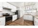 Modern kitchen with white shaker cabinets and granite countertops at 17149 E El Pueblo Blvd, Fountain Hills, AZ 85268