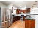 Kitchen features dark wood cabinets and stainless steel appliances at 17149 E El Pueblo Blvd, Fountain Hills, AZ 85268