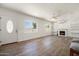 Bright and spacious living room with wood floors and fireplace at 17149 E El Pueblo Blvd, Fountain Hills, AZ 85268