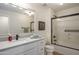 Well-lit bathroom with a single sink vanity, large mirror, and shower-tub combination at 17850 N 68Th St # 3120, Phoenix, AZ 85054