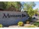 Elegant stone sign marking the entrance to Monterey Ridge, set amidst lush landscaping and trees at 17850 N 68Th St # 3120, Phoenix, AZ 85054