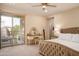 Relaxing primary bedroom featuring a balcony, vanity area, and neutral color palette at 17850 N 68Th St # 3120, Phoenix, AZ 85054