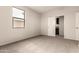 Spacious bedroom with an adjacent office or storage area at 1820 N 94Th Gln, Phoenix, AZ 85037