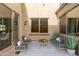 Private patio with comfortable seating and a tranquil atmosphere at 1820 N 94Th Gln, Phoenix, AZ 85037