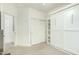 Bedroom with double door closet and built-in shelving at 1918 E Bridgeport Pkwy # 102, Gilbert, AZ 85295