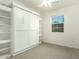 Bedroom with built-in shelving and a Murphy bed at 1918 E Bridgeport Pkwy # 102, Gilbert, AZ 85295