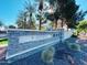 The Lakes at Annecy community entrance sign, featuring a stone design and landscaping at 1918 E Bridgeport Pkwy # 102, Gilbert, AZ 85295