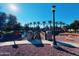 Wooden footbridge over a tranquil community lake at 1918 E Bridgeport Pkwy # 102, Gilbert, AZ 85295