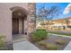 Inviting front entrance with stone accents and landscaping at 1918 E Bridgeport Pkwy # 102, Gilbert, AZ 85295