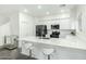 Modern kitchen with stainless steel appliances and white cabinets at 1918 E Bridgeport Pkwy # 102, Gilbert, AZ 85295