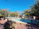 Community pool and spa area with lounge chairs and landscaping at 1918 E Bridgeport Pkwy # 102, Gilbert, AZ 85295