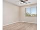 Bright bedroom with ceiling fan and hardwood floors at 19430 E Erik Ct, Florence, AZ 85132