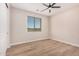 Bedroom featuring wood-look floors and a window with blinds at 19430 E Erik Ct, Florence, AZ 85132