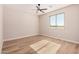 Light and bright bedroom with ceiling fan and window at 19430 E Erik Ct, Florence, AZ 85132