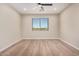 Spacious bedroom with hardwood floors and a large window at 19430 E Erik Ct, Florence, AZ 85132