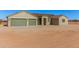 Tan house with three-car garage and desert landscaping at 19430 E Erik Ct, Florence, AZ 85132