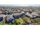 Aerial view showcasing the house's backyard, neighborhood, and surrounding landscape at 1956 W Black Hill Rd, Phoenix, AZ 85085