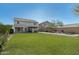 Large grassy backyard with pergola, fire pit, and raised garden bed at 1956 W Black Hill Rd, Phoenix, AZ 85085