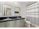 Clean bathroom with double sinks, gray cabinets, and shower/tub combo at 1956 W Black Hill Rd, Phoenix, AZ 85085