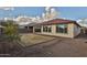 Tan house with red tile roof and small backyard at 19587 W Marshall Ave, Litchfield Park, AZ 85340