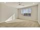 Bright bedroom with carpet flooring and ceiling fan at 19587 W Marshall Ave, Litchfield Park, AZ 85340