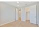 Bright bedroom featuring a ceiling fan and walk-in closet at 19587 W Marshall Ave, Litchfield Park, AZ 85340