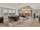 Light-filled dining room with modern furniture and a large sliding glass door leading to the patio at 19587 W Marshall Ave, Litchfield Park, AZ 85340