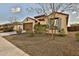 House exterior showcasing landscaping and a brown garage door at 19587 W Marshall Ave, Litchfield Park, AZ 85340