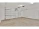 Attached garage with light-colored concrete floor at 19587 W Marshall Ave, Litchfield Park, AZ 85340