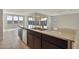 Kitchen island with sink and view of backyard patio at 19587 W Marshall Ave, Litchfield Park, AZ 85340