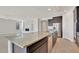 Kitchen island with granite countertops, sink, and dishwasher at 19587 W Marshall Ave, Litchfield Park, AZ 85340