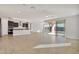 Modern kitchen with dark cabinetry, granite counters, and stainless steel appliances at 19587 W Marshall Ave, Litchfield Park, AZ 85340