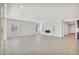 Living room with tile floors, fireplace and access to kitchen at 19587 W Marshall Ave, Litchfield Park, AZ 85340