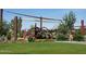 Modern playground with shade structures and play equipment at 19587 W Marshall Ave, Litchfield Park, AZ 85340