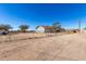 House with a gravel area in front and a chain link fence at 21701 W Griffin Ave, Wittmann, AZ 85361