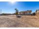 House with chain link fence and a gravel driveway at 21701 W Griffin Ave, Wittmann, AZ 85361