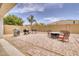 Covered patio with seating area overlooking the backyard at 22235 E Cherrywood Dr, Queen Creek, AZ 85142